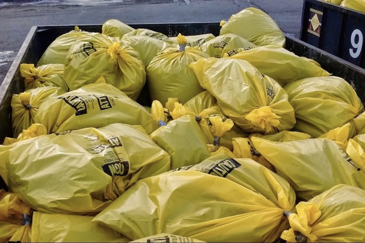 Sealed and labelled asbestos waste bags ready for manifested disposal